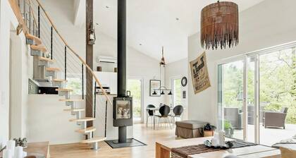 Modern stone house with hot tub in Åsljunga forest