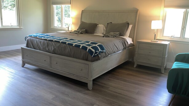 A bedroom with a bed, nightstands, a dresser, and a window. - Amazing 6-bedroom house with AC in adorable Bethesda (Bethesda)