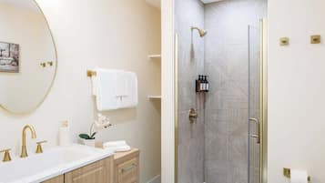 Shower, hair dryer, towels, shampoo