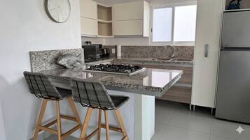 Luxury Apartment | Private kitchen | Fridge, microwave, oven, stovetop