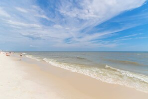 A beach with a clear sky and calm sea. - Super Clean, Pool, Beach, Dining, Fun (Orange Beach)