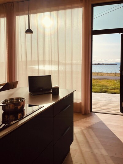 Design cabin by the sea with Northern Lights