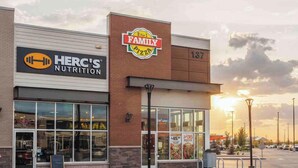 A Family Pizza store with a sign above the entrance, a visible address number, and a clear view of the sky. - Serene and Stylish House Rental in Brighton, Saskatoon (Saskatoon)