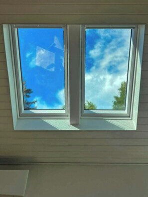 A skylight with two windows, allowing natural light into a room. - Family oasis near nature, beach & Sommerland (Højby)