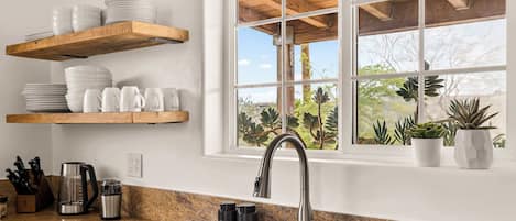 Kitchen sink with open shelves