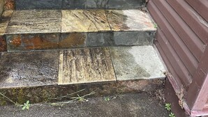 A set of stone steps leading to a door, a mailbox, and a number '1' sign. - Entire Home with Three Bedroom at the heart of Vancouver (Vancouver)
