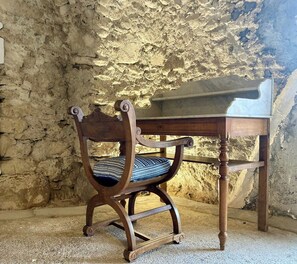 A wooden chair with a patterned cushion and a small wooden table with a marble top. - Renovated little house with High Alps view (Baratier)