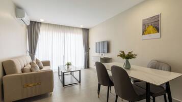 Family Apartment, Balcony, City View | Living area | Printers