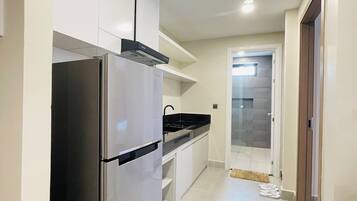 Mini-fridge, dishwasher, cookware/dishes/utensils