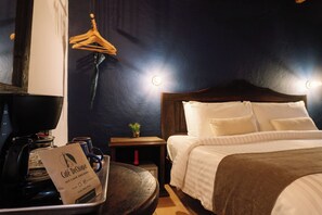 In-room safe, desk, laptop workspace, blackout drapes - Docecuartos Hotel (San Cristóbal de las Casas)
