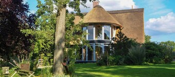Apartment in a thatched cottage with private lake