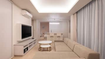 Corner Junior Suite | Living area | 52-inch flat-screen TV with digital channels