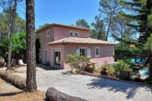 A two-story house with a tiled roof, surrounded by trees and a gravel driveway. - Authentic villa in the Var countryside (Les Arcs)