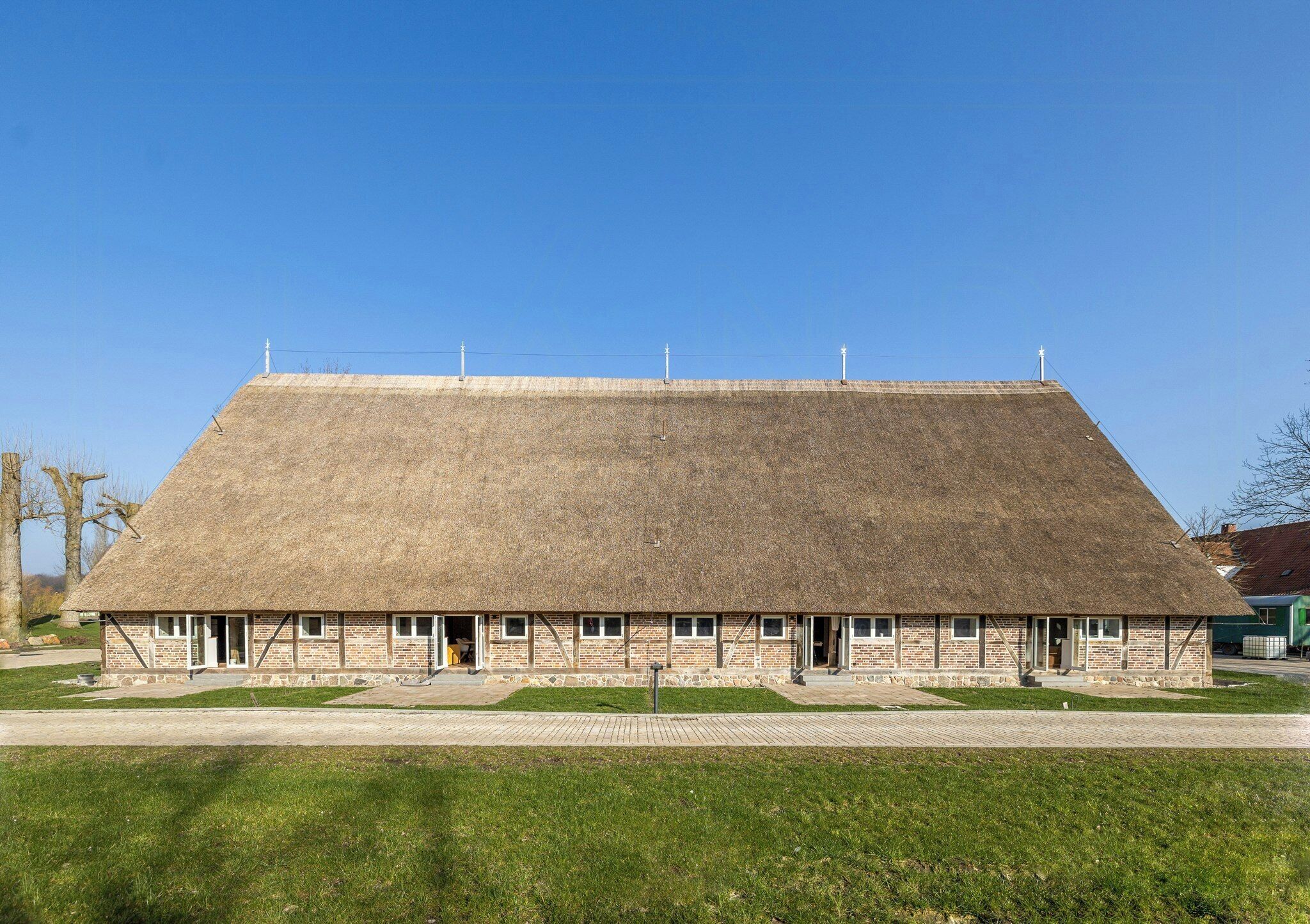 A building with a large, flat roof and a brick facade.