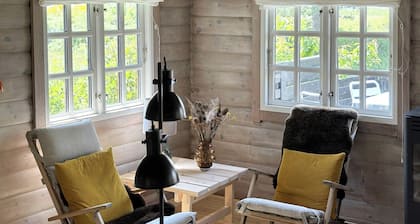 Log cabin in the front row overlooking the sea