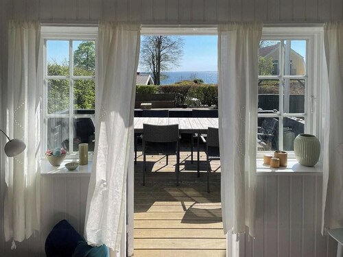 Thatched wooden house with sea view