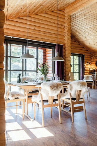 Authentic log house amid evergreens in Vendsyssel