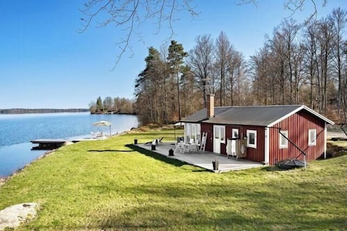 Cottage with beach plot, boat and jetty in Småland