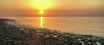 Summer house with sunset over Sejerø Bay