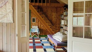 A cozy room with a checkered floor, a bed, a chair, and a bookshelf. - Artist's dream in scenic Södermanland (Gnesta)