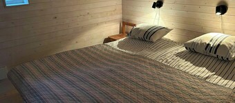Wooden cottages by quarry with views