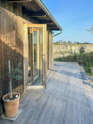 Wooden cottages by quarry with views