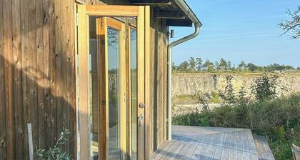 Wooden cottages by quarry with views