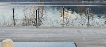 Seafront retreat with panoramic mountain views