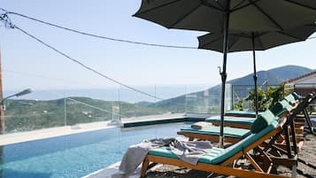 Seasonal outdoor pool, pool umbrellas, sun loungers