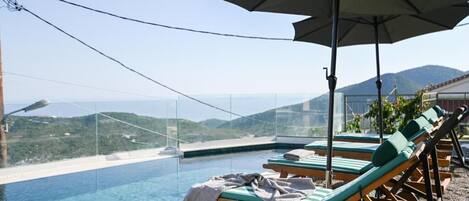 Seasonal outdoor pool, pool umbrellas, sun loungers