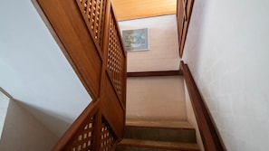 A wooden staircase with a picture on the wall. - Sandilands 1 - Lifestyle Yamba (YAMBA)