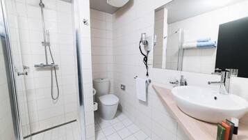 Bathtub, hair dryer, towels