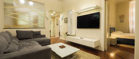 Apartment, 3 Bedrooms, 2 Bathrooms | Living area | 32-inch flat-screen TV with cable channels