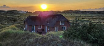 Thatched house in the first row by the North Sea