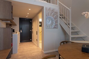 Deluxe Apartment, Balcony | Living area | 50-inch Smart TV with digital channels, Netflix, streaming services