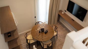 Deluxe Apartment, Balcony | Living area | 50-inch Smart TV with digital channels, Netflix, streaming services