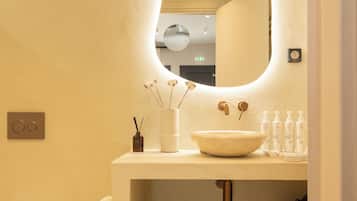 Deluxe Suite, Balcony | Bathroom | Shower, rainfall showerhead, hair dryer, bathrobes