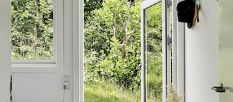 Solnedgång över Sejerøbugten Bay från huset