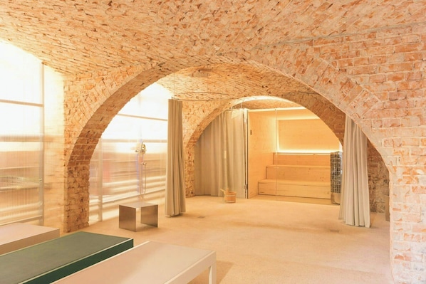 A room with a brick ceiling, a large window, a shower, and a bed. - Apartment in the commandery near the Elbe (Werben)