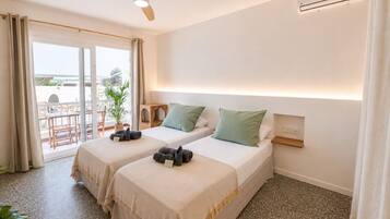 Deluxe Double or Twin Room, Pool View | Desk, laptop workspace, blackout drapes, soundproofing