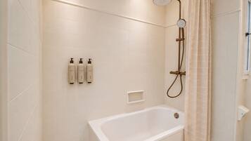Deluxe Double or Twin Room, Pool View | Bathroom | Hair dryer, towels, soap, shampoo