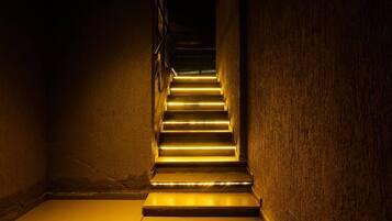 A staircase with illuminated steps leading upwards.