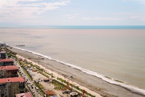 A coastal hotel with a beach view, a pier, and a boardwalk with amenities. - Black Sea Point Apartments 5 (Batumi)
