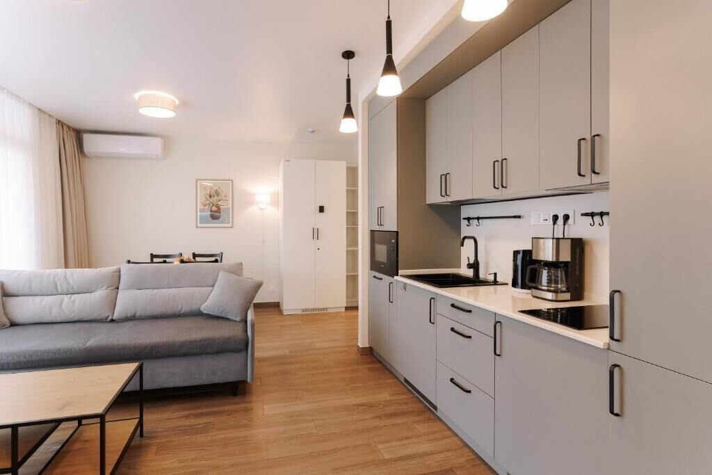 Deluxe-Apartment, Balkon, Meerblick | Wohnbereich
