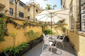 Comfort Quadruple Room, Kitchenette, Courtyard Area | Outdoor dining