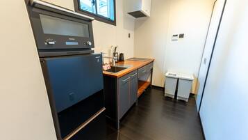 Villa | Private kitchen | Full-size fridge, microwave, cookware/dishes/utensils