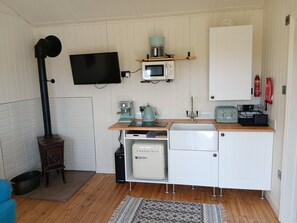 Cabana, 1 quarto, sacada, vista para o jardim | Parte interna