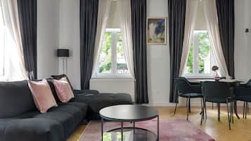 Deluxe Apartment, 1 Bedroom, City View, Beachside | Living area | 40-inch Smart TV with cable channels