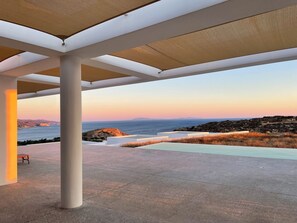 A covered outdoor area with a view of the sea and rocky landscape. - Laurentis Villa - Architect home with 180° sea views and a path to a wild beach (Chora)