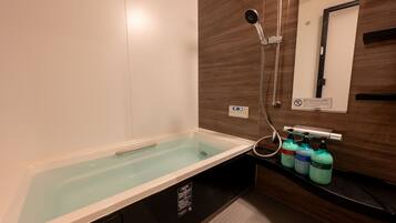 Villa | Bathroom | Separate tub and shower, hair dryer, towels, shampoo